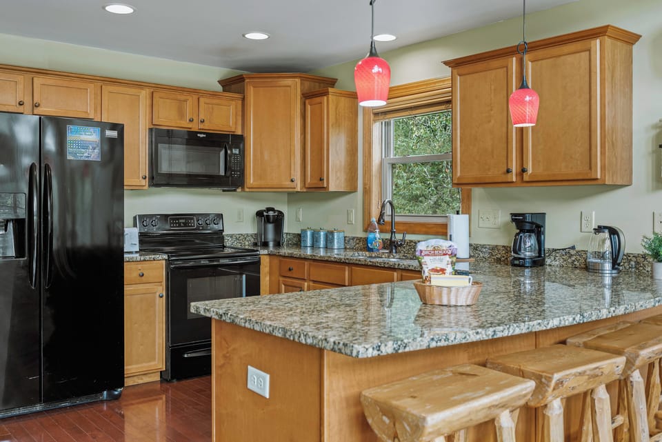 Modern kitchen with sleek appliances and ample counter space.