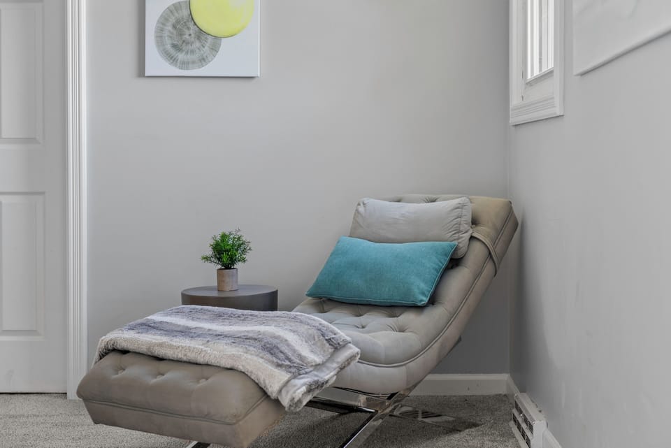 Spacious primary bedroom with seating nook