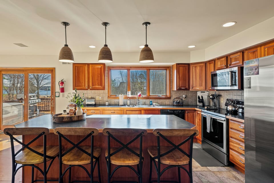 Barstool seating at the kitchen counter.