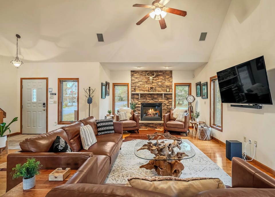 Living room with a fireplace and TV.