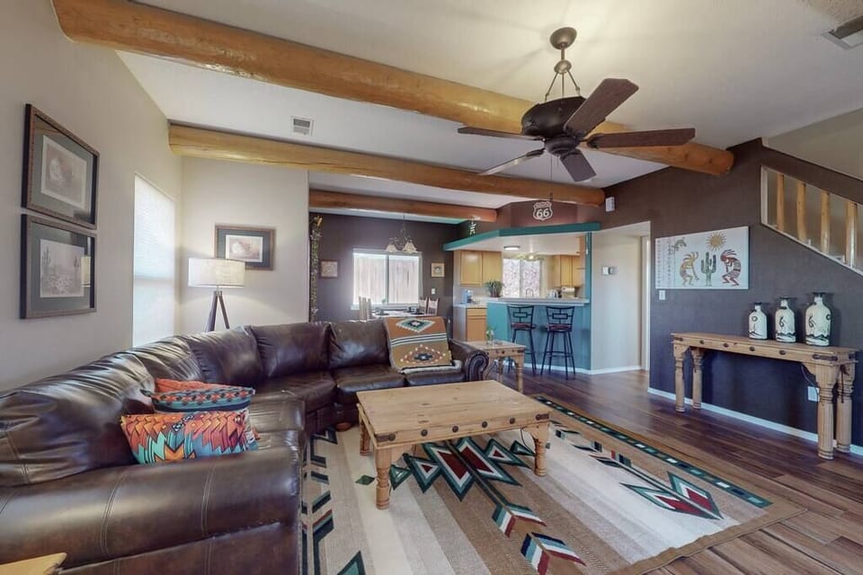 Kick back, relax in the spacious living room and dining area with beautiful local southwestern decor and large, comfortable leather sectional 