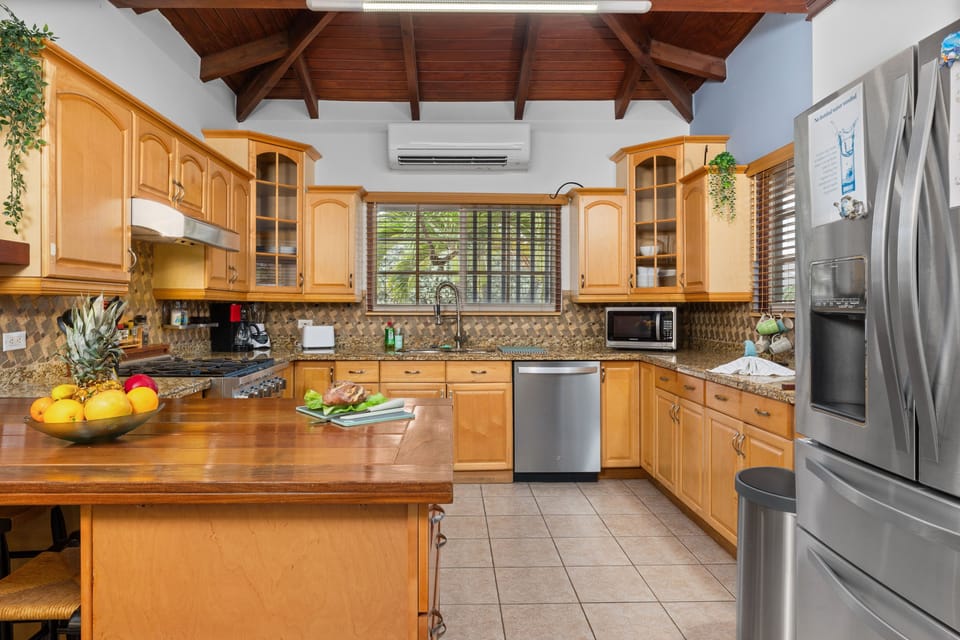 Chef's litchen with spacious island, perfect for preparing meals for thee group.