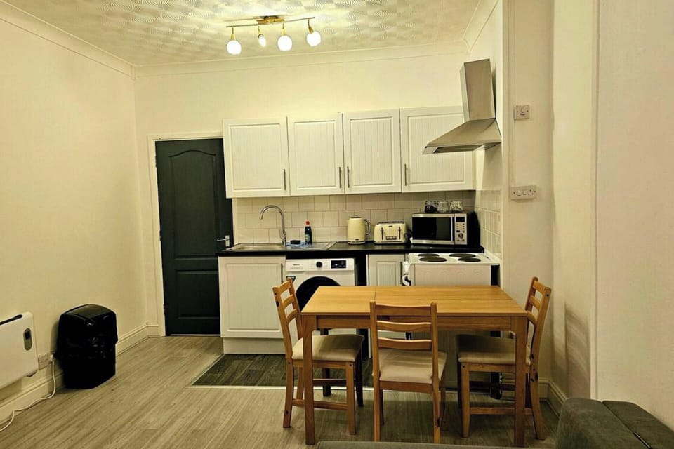 Enjoy meals in the dining area equipped with a table and chairs. Ideal for sharing meals, planning your day, or enjoying a cup of coffee. 
