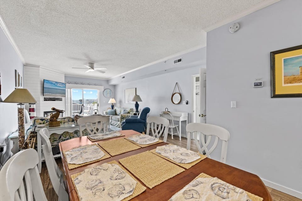 Open concept main living area - dining table for 6 and 3 barstools