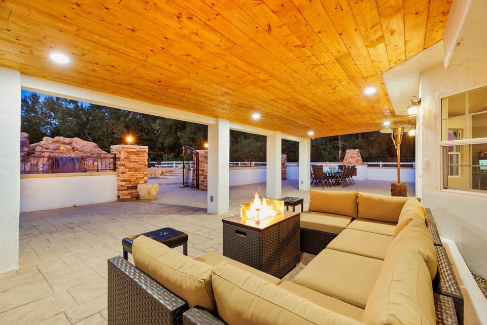 Outdoor fire pit in a covered area perfect for chill night with friends and family. 