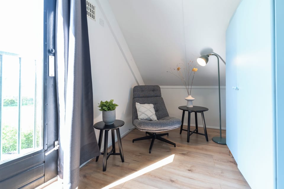 Stylish room with comfy chair—ideal for reading or relaxing.