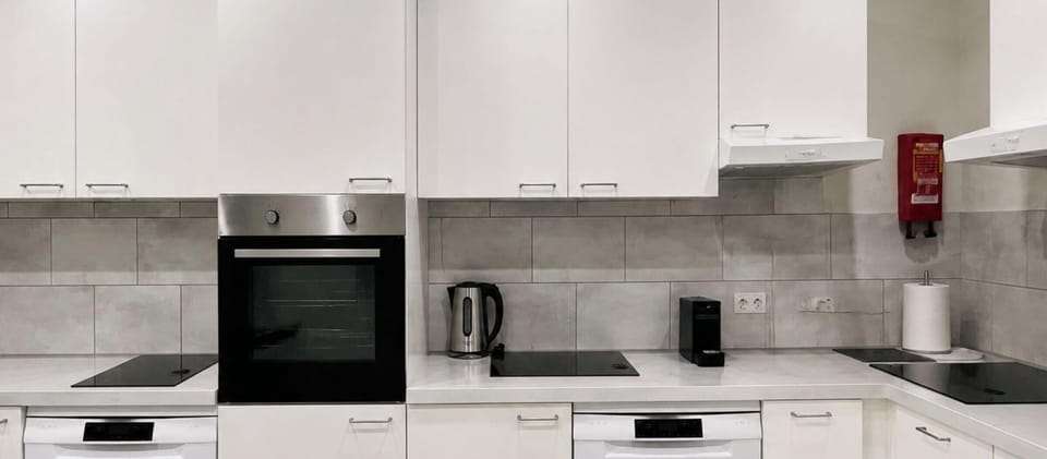 Bright and spacious shared kitchen, perfect for preparing meals during your stay.