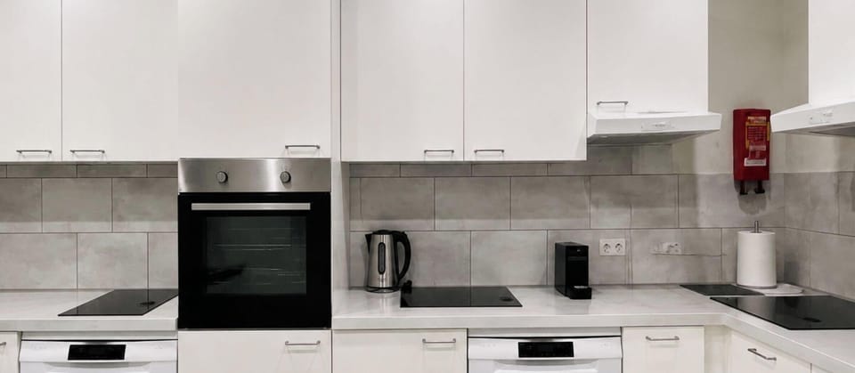 Cook comfortably in this spacious shared kitchen with modern appliances.