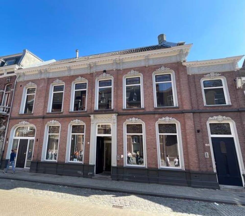 Stunning exterior of a historic building in the heart of Tilburg, featuring charming architecture and a prime location.