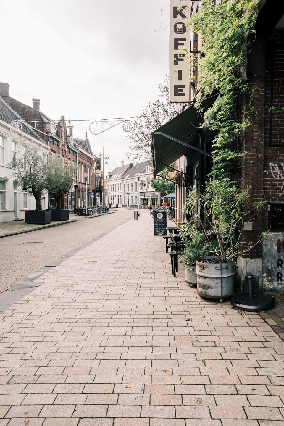 Scenic view of a charming street lined with cafes and quaint buildings, offering a relaxed atmosphere and easy access to local amenities.