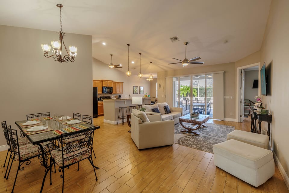 Dining and Living Space - - Host unforgettable meals in the elegant dining area designed for connection
- Plush living room seating beckons for cozy chats or movie nights
- Sliding doors bring in natural light and lead to your serene outdoor escape