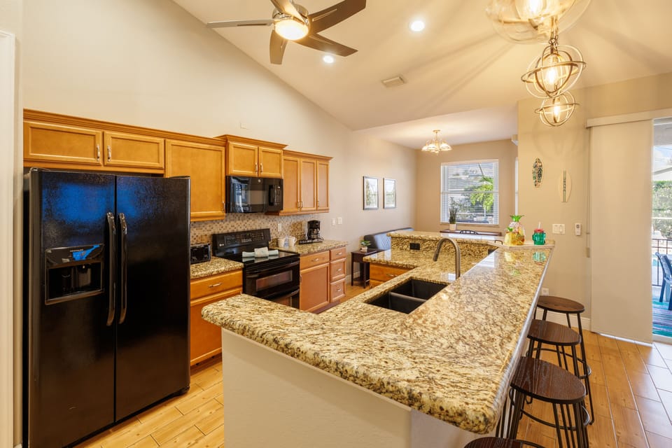 Entertainer’s Dream - - Cook like a pro on sleek granite countertops that offer both style and function
- Modern black appliances and a chic backsplash bring a bold, contemporary vibe
- Start your day with a fresh brew from the coffee station, pure kitchen perfection