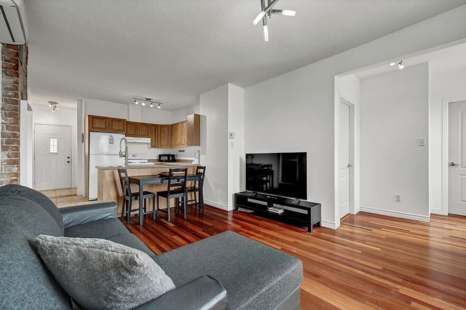 Open-concept layout connecting living room, dining area, and kitchen for easy entertaining.