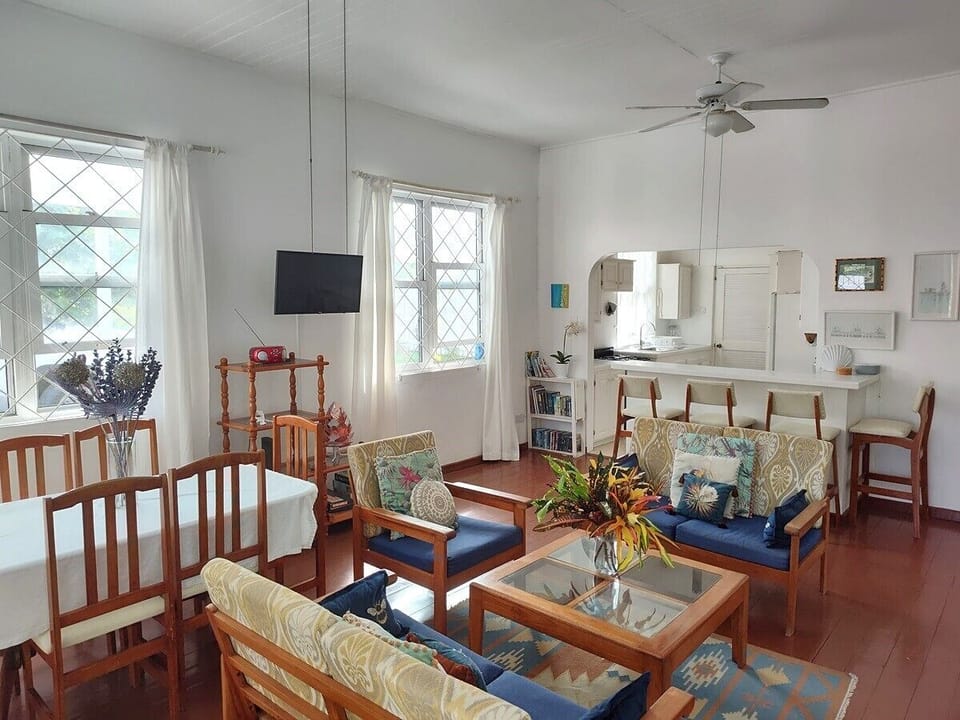 Living room, indoor dining and bar kitchen.