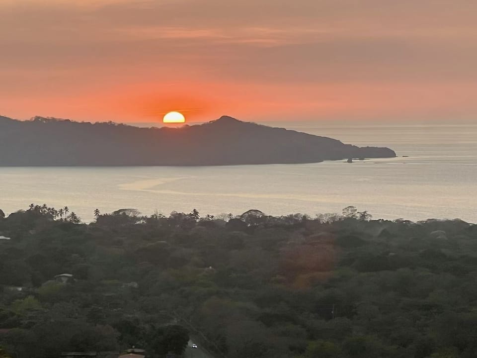 Watch the sun dip in the ocean.