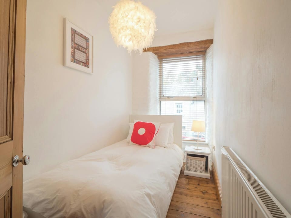 Single bed and bedside cabinet and lamp