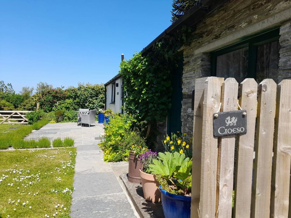 Path leading to the cottage with a lawn area