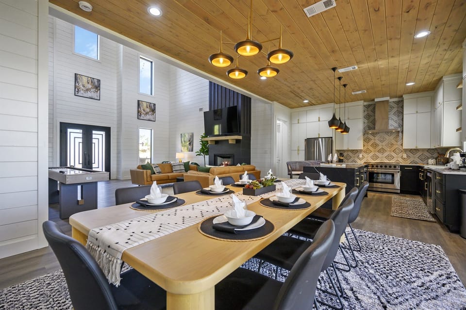 Modern open-concept kitchen, dining, and great room offer lots of room for your group.