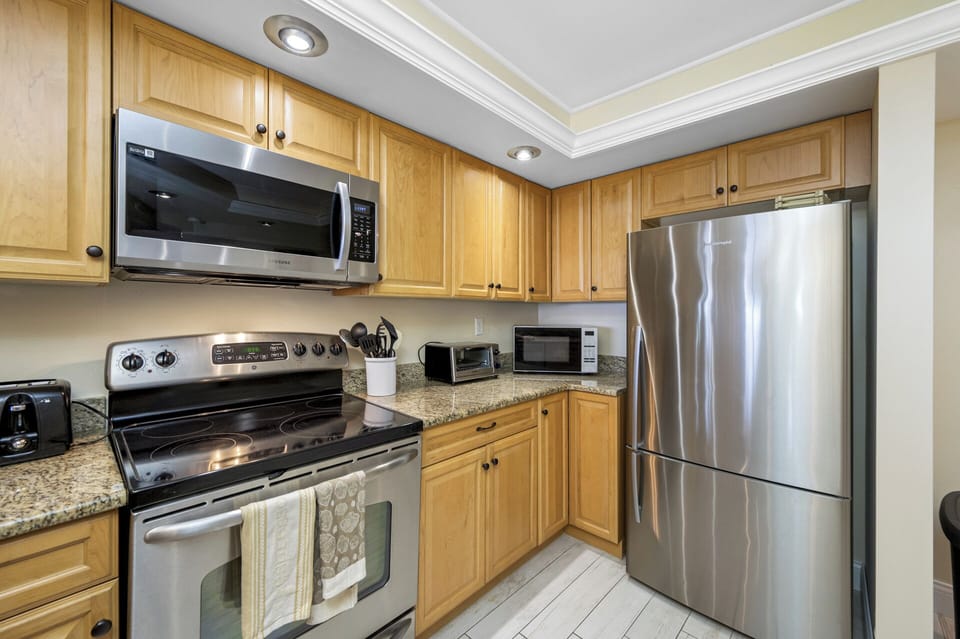 Enjoy a kitchen with all the essentials, including a large fridge and modern appliances.