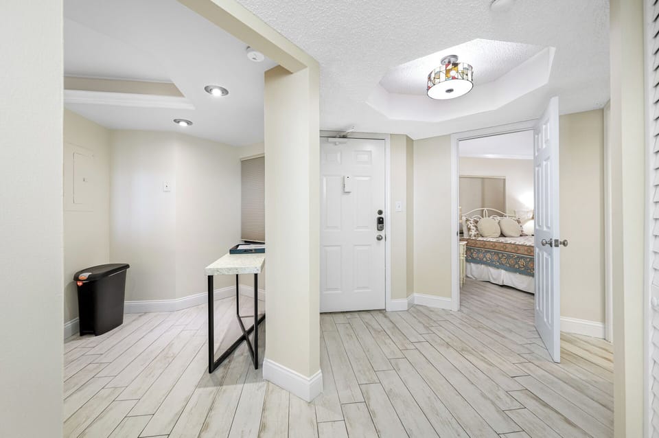 Bright and welcoming entryway with a clean and modern design, setting the tone for your stay.