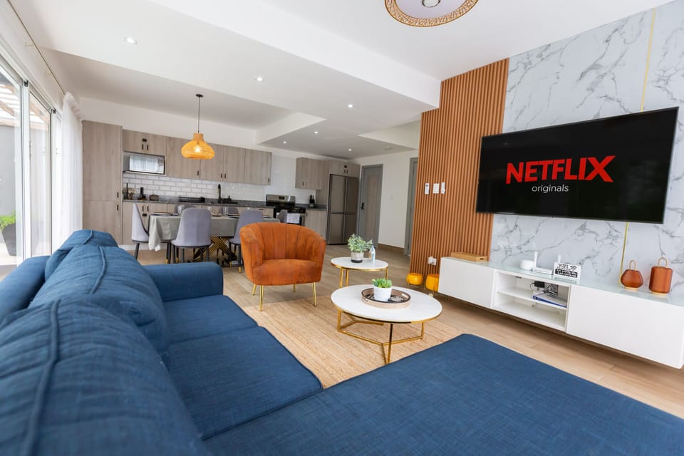 Comfort and convenience in our living space, featuring a Smart TV, high-speed WiFi, fully equipped kitchen, and dining area for six