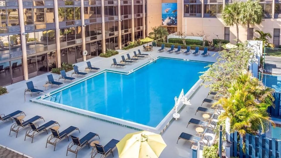 Dive into resort-style relaxation with loungers surrounding the pool.