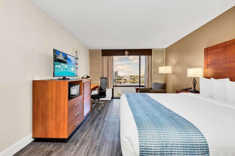 Settle in comfortably with in-room entertainment and a work desk.