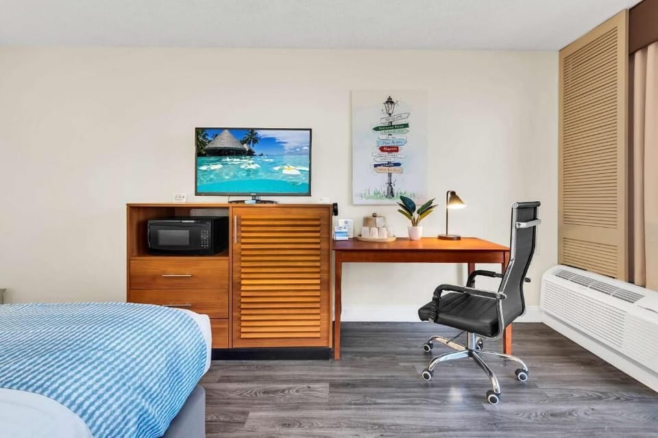 Catch up on emails at the desk with handy in-room snacks.