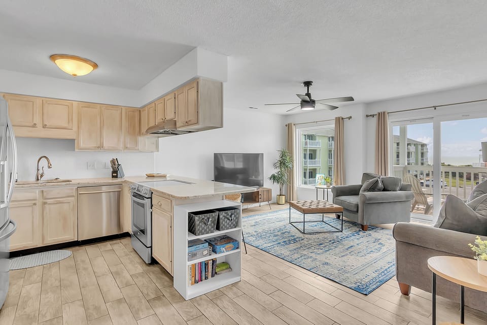 Relax in your bright, open-concept space where the modern kitchen flows seamlessly into your comfortable living area with city views.