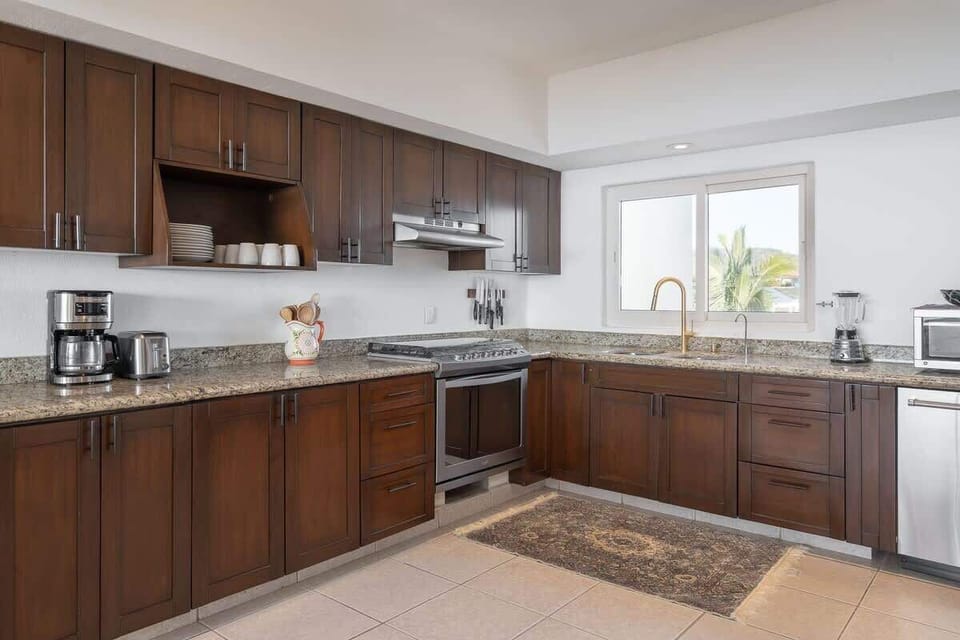 Fully equipped beach house kitchen with modern appliances
