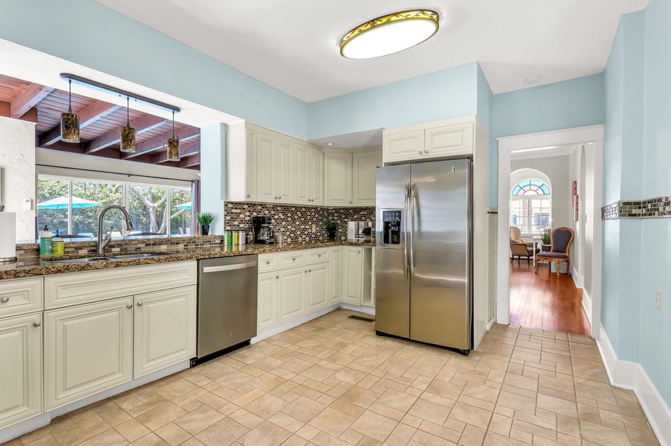 Prepare to unleash your culinary creativity in this fully-equipped kitchen! Stocked with indoor and outdoor dining sets, an array of cooking utensils, bakeware, and a variety of appliances including a blender, toaster, microwave, and more.