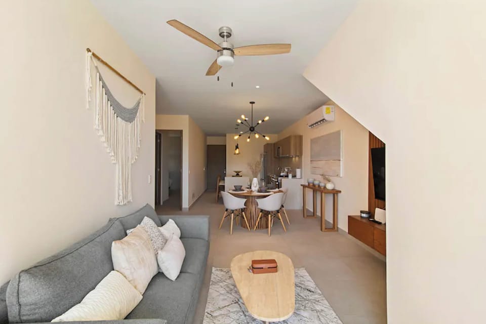 Cozy living room: Generous couch for guests or movie nights.