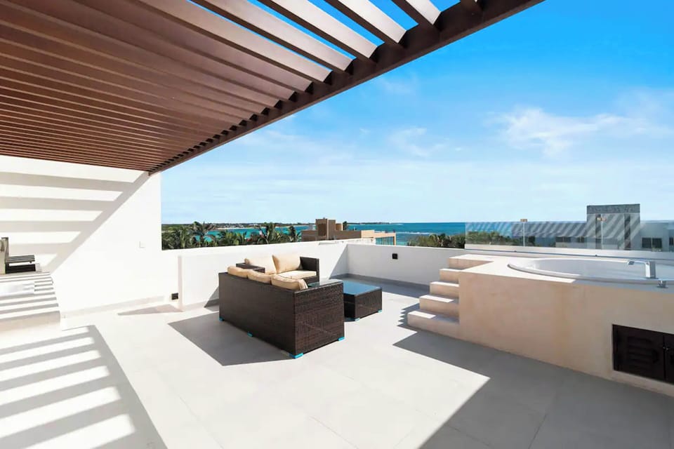 Private terrace with luxurious jacuzzi, stunning Caribbean Sea views. Relaxation redefined.