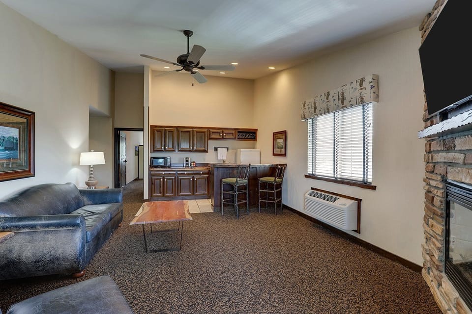Gather together in an airy living space with snack bar.