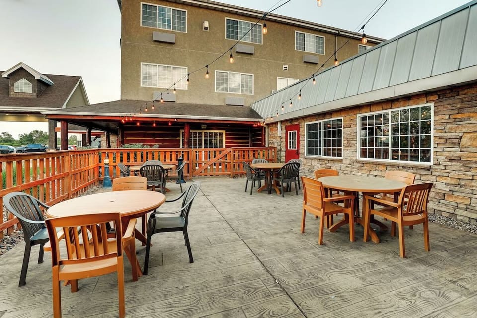 Sip drinks outdoors under string lights on the open patio.