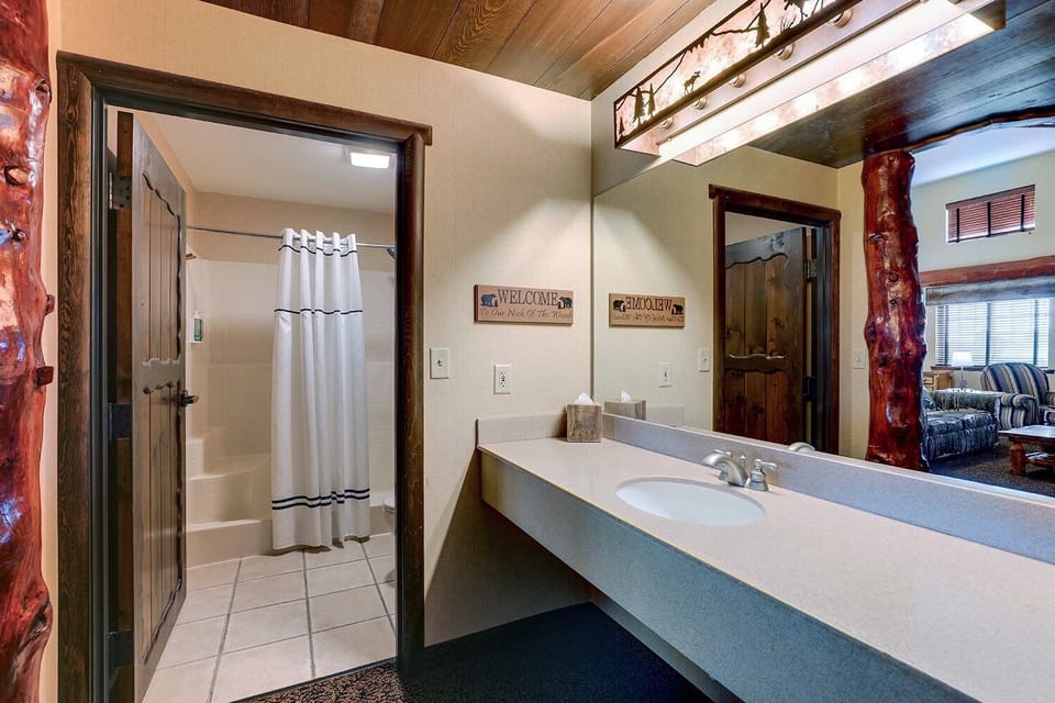 Refresh easily with a bright vanity and convenient tub-shower.
