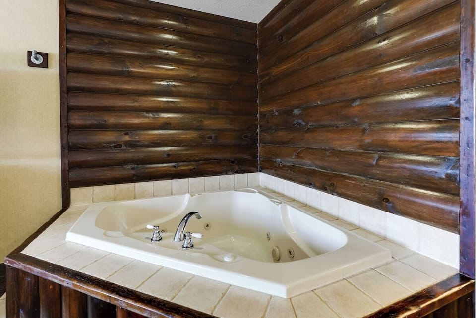 Soothe tired muscles with a private, bubbling jetted tub.
