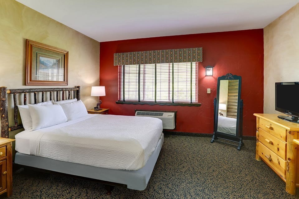 Relax into crisp linens and natural light by the window.