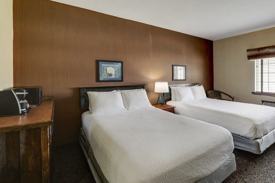 Drift off on crisp linens under warm bedside lighting