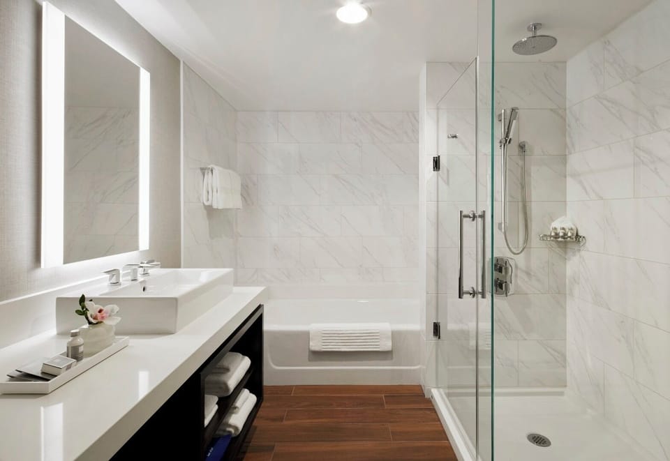 Refresh under the rainfall shower in a spa-bright bath.
