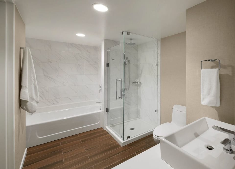 Soak and reset with a deep tub and glass shower.