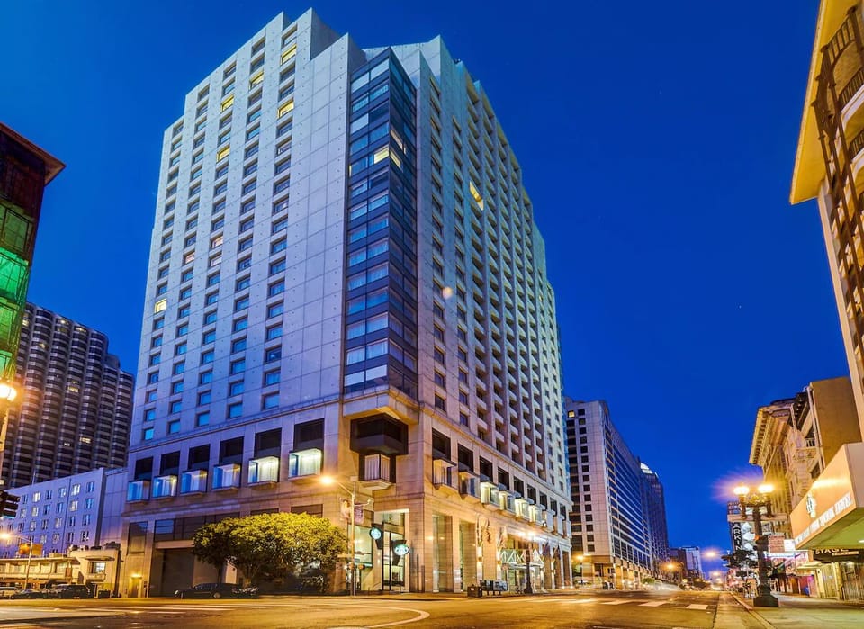Arrive in style at a glowing high-rise city hotel.