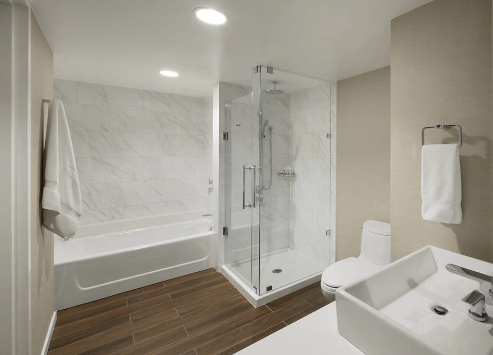 Refresh in a spa-bright bath with glass walk-in shower.