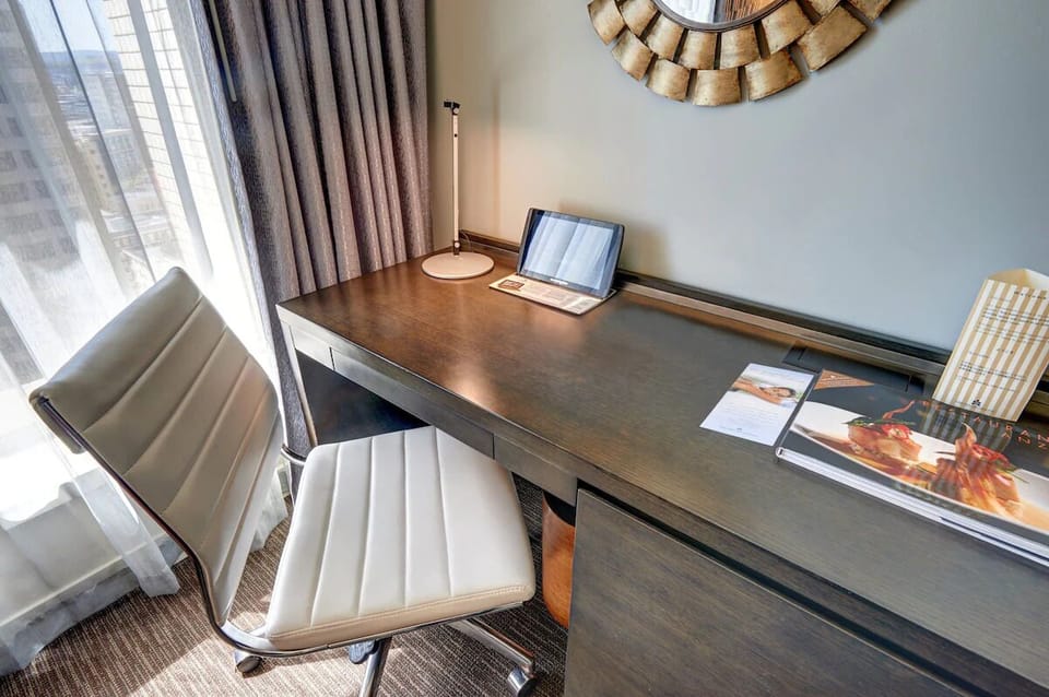 Get focused at the sleek desk with natural daylight.