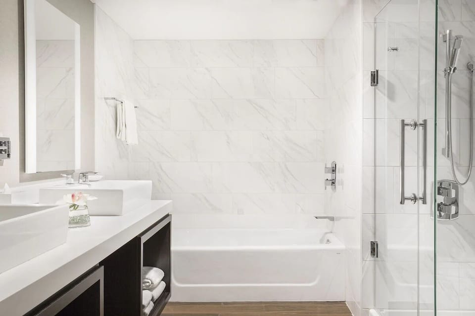 Indulge in a bright marble bath with spa-like finishes.
