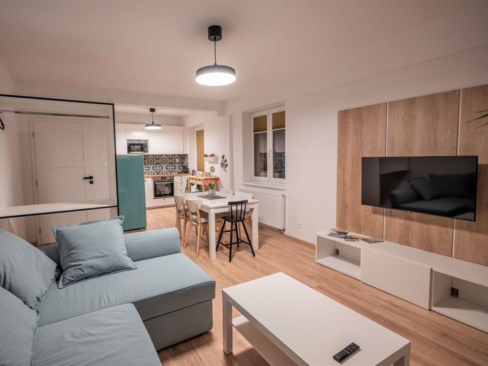 Furniture, Couch, Property, Table, Television, Interior Design, Comfort, Wood, Home Appliance, Living Room