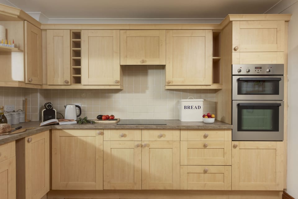 Godolphin, Roserrow. Ground Floor: With an electric oven and hob, fridge/freezer, coffee machine and dishwasher