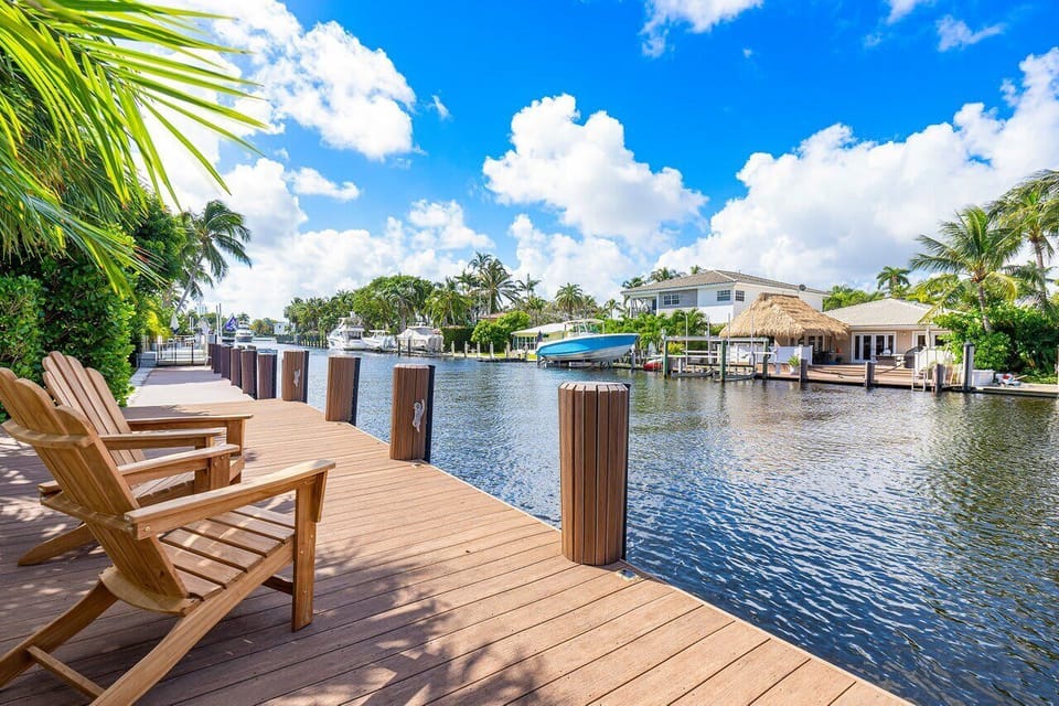 Private waterfront dock with cozy seating and stunning canal views.