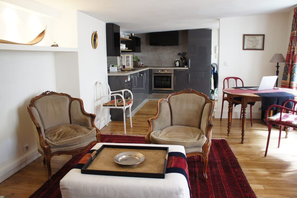 view from sofa towards dining table and kitchen