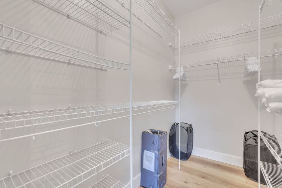 Large walk-in master closet with shelving